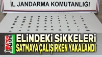 Elindeki sikkeleri satmak isterken yakalandı